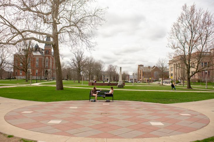 students sitting in academic quad
